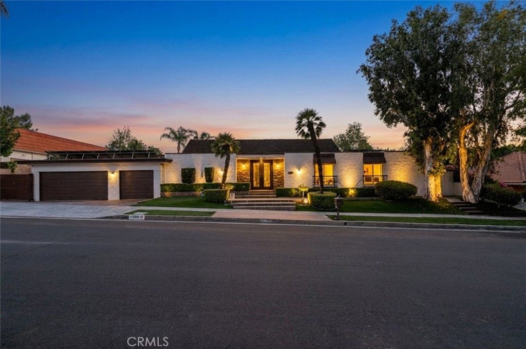 Single-story Northridge home with pool and palm trees on a 14,800 square foot lot